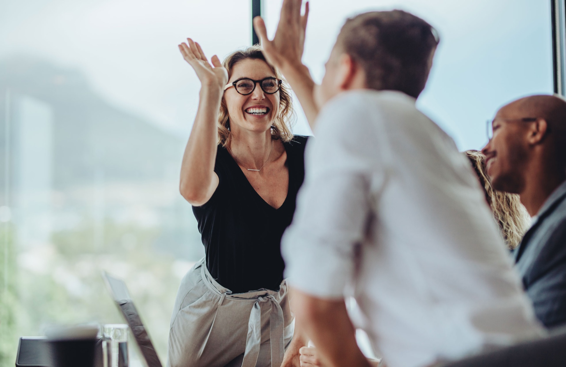 Colleagues celebrating with a high five