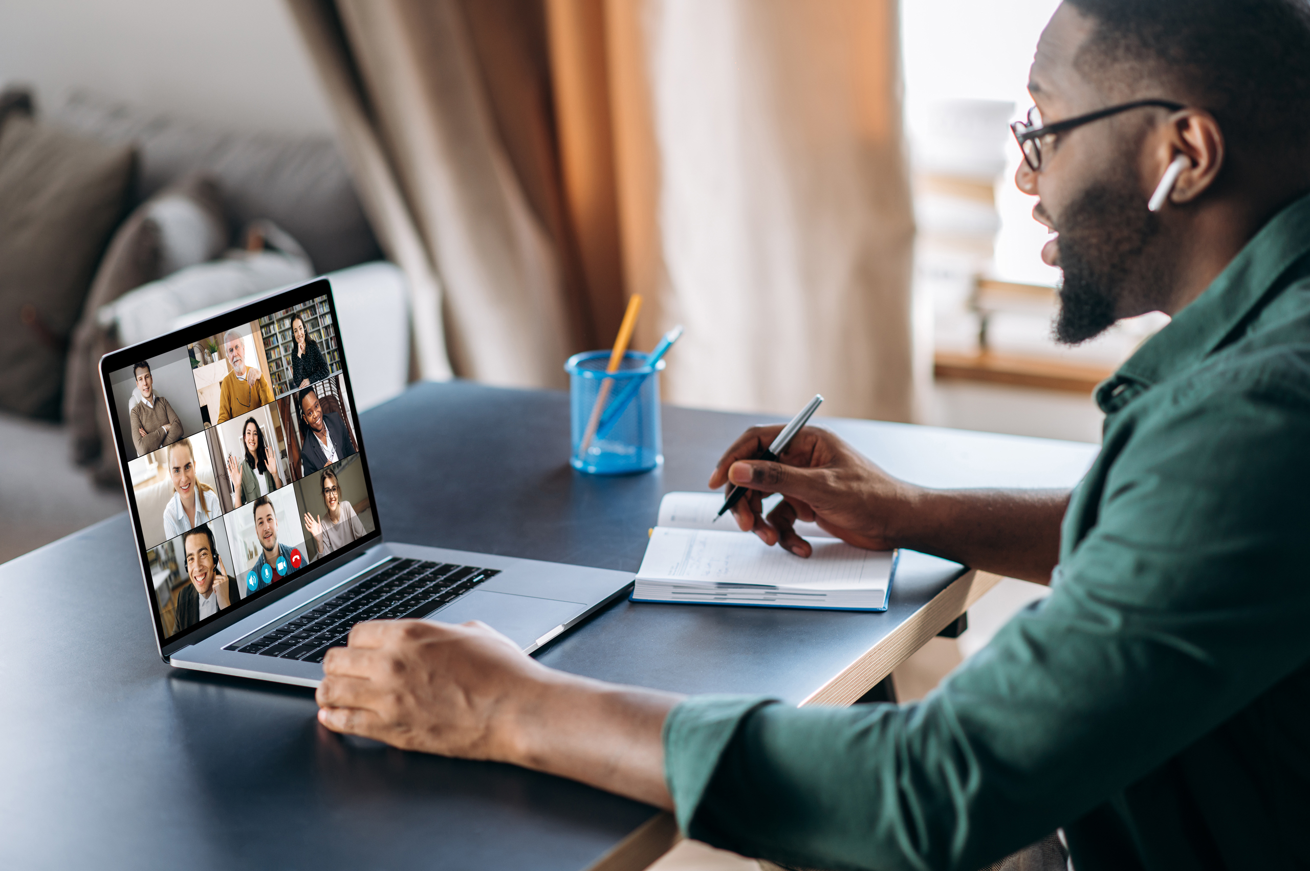 young male professional listening and talking during the Train-the-Trainer virtual session 